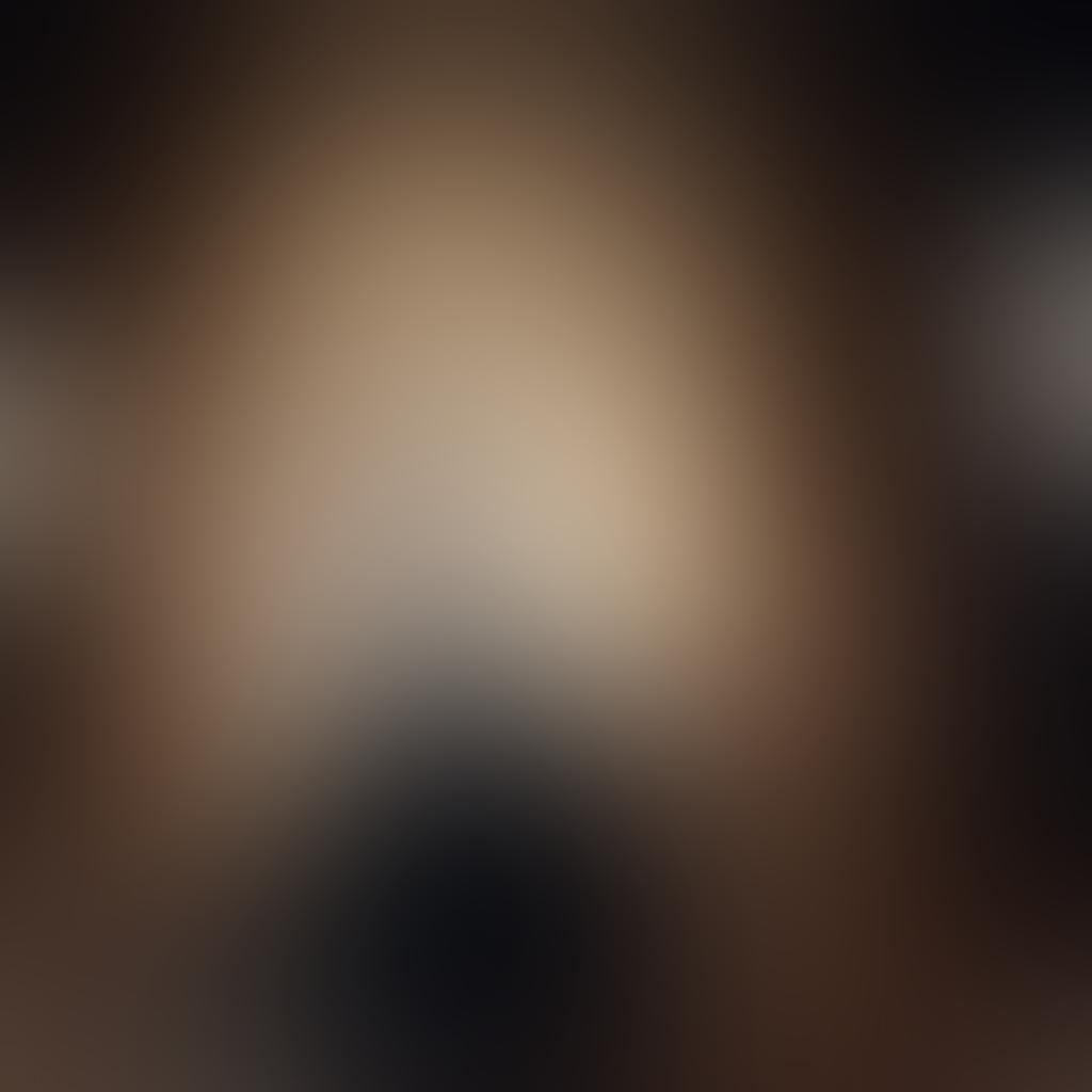 A captivating scene showcasing a photographer capturing a sensual portrait of a model in an elegant, softly lit studio. The composition includes artistic lighting enhancing the curves and contours of the model’s silhouette, surrounded by rich textures like velvet drapes and soft pillows. A blurred background adds depth, focusing on the intimate connection between the photographer and the subject. The mood is alluring and tasteful, with an emphasis on creativity and artistry. super-realistic. rich colors. soft focus.